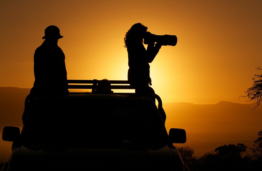 Silhouetted against a deep orange sky, Hauser quietly captures magnificent moments in her life as a visual storyteller. 